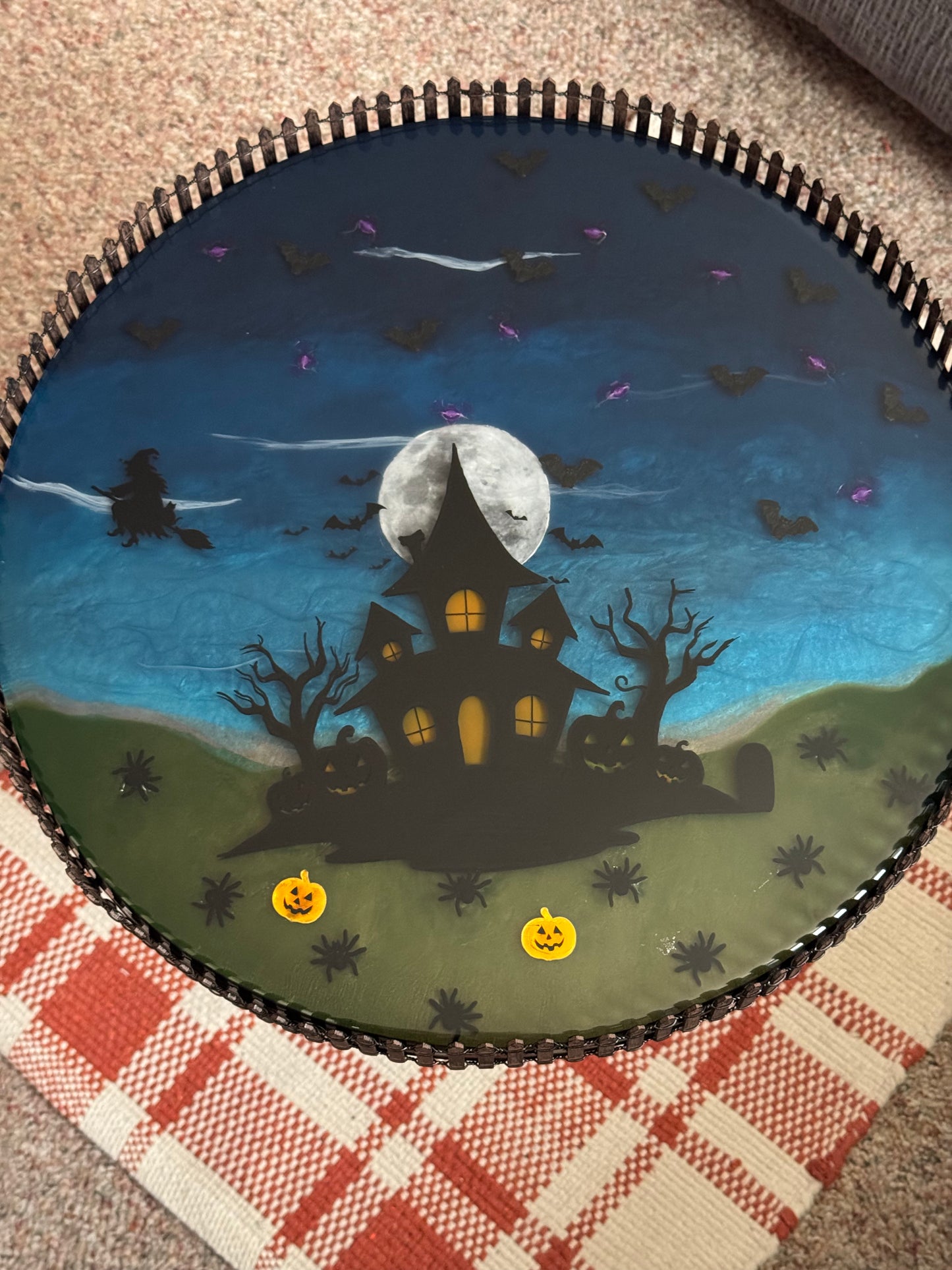 Halloween themed resin table with led bat lights inside.
