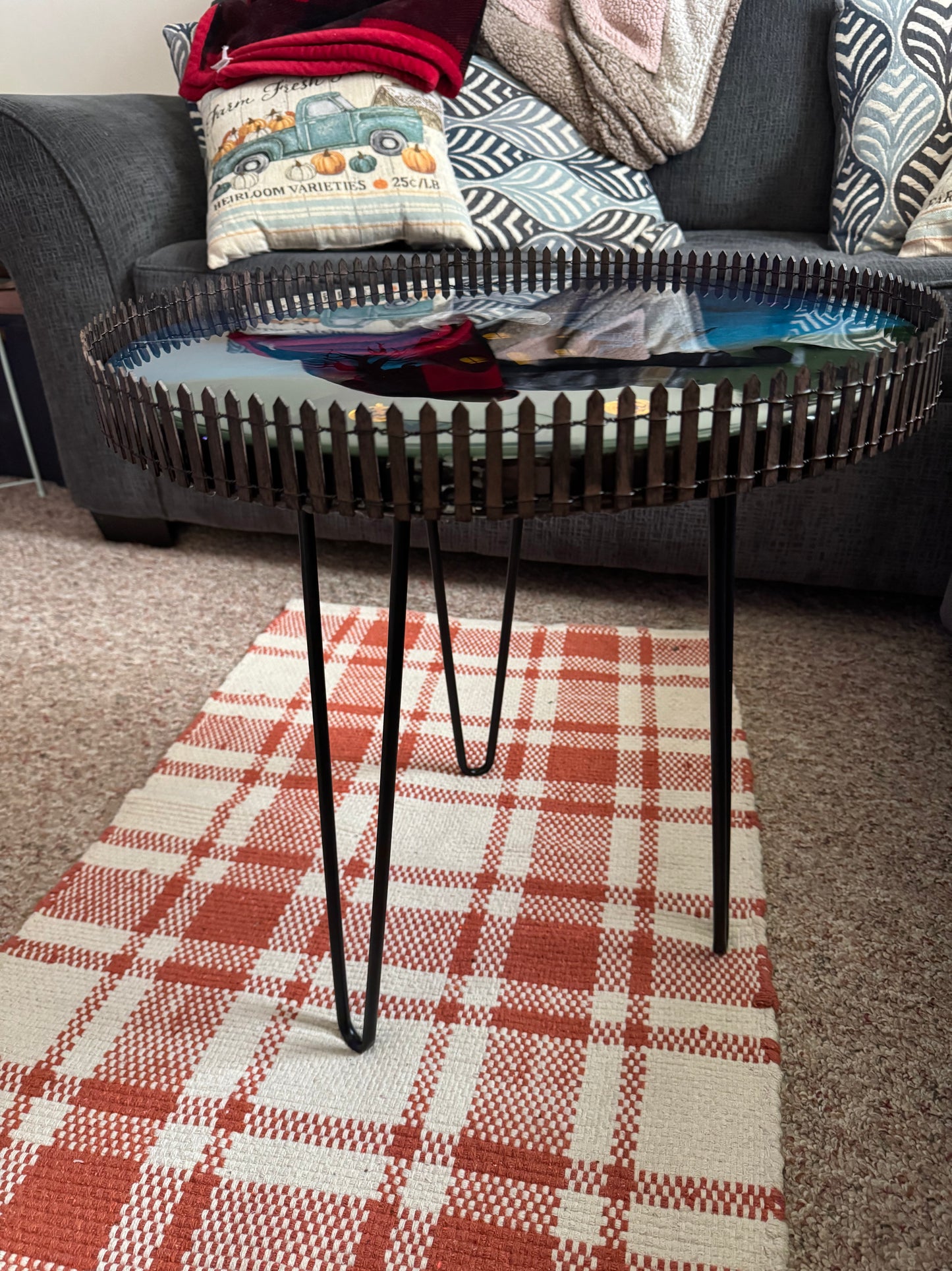 Halloween themed resin table with led bat lights inside.