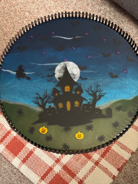 Halloween themed resin table with led bat lights inside.